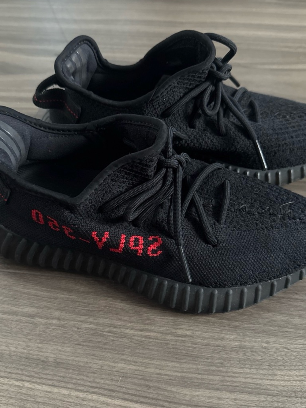 Yeezy Black Sneakers with Red Accent